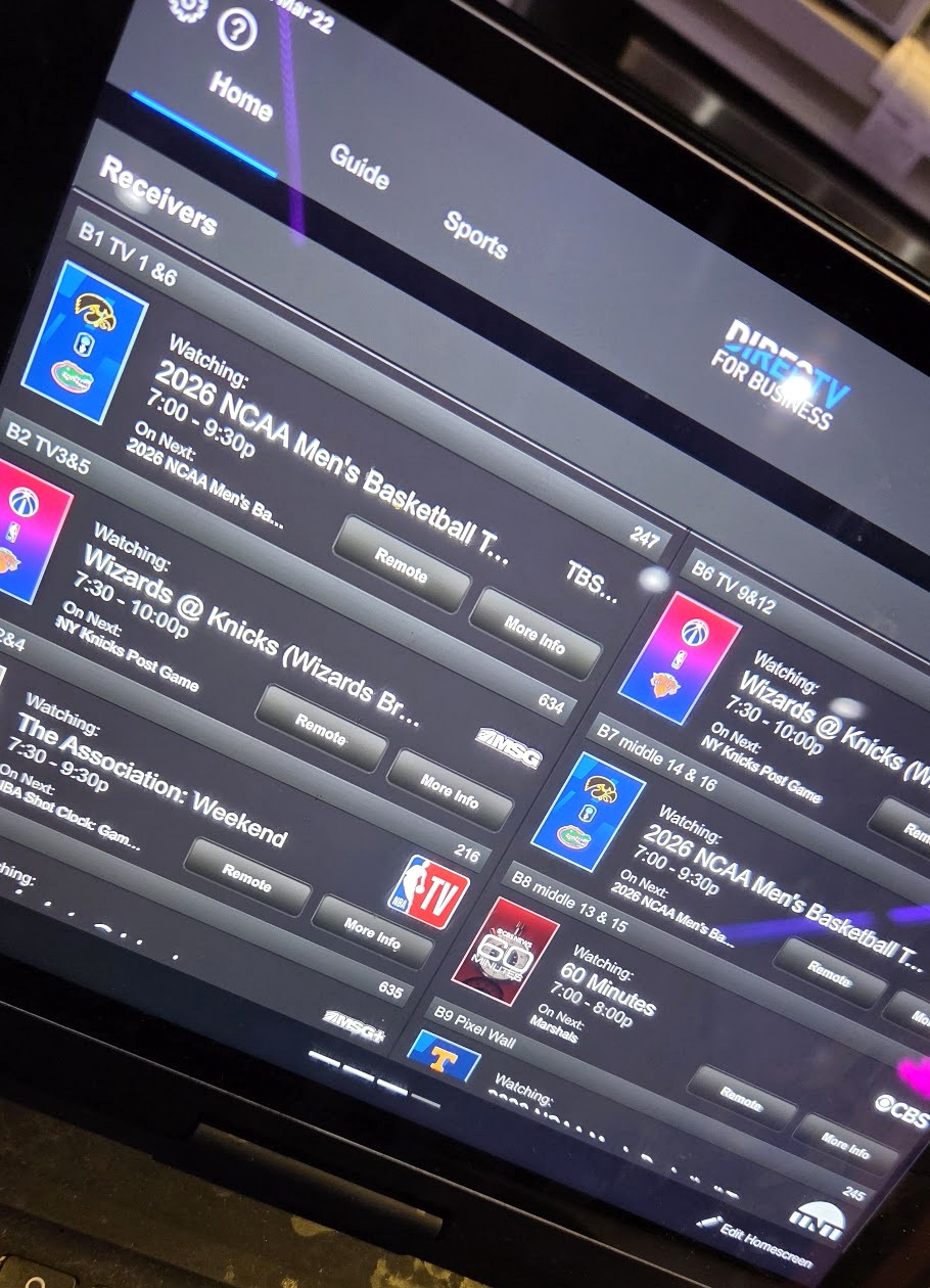 Tablet showing a commercial AV control app managing multiple TV receivers from one screen